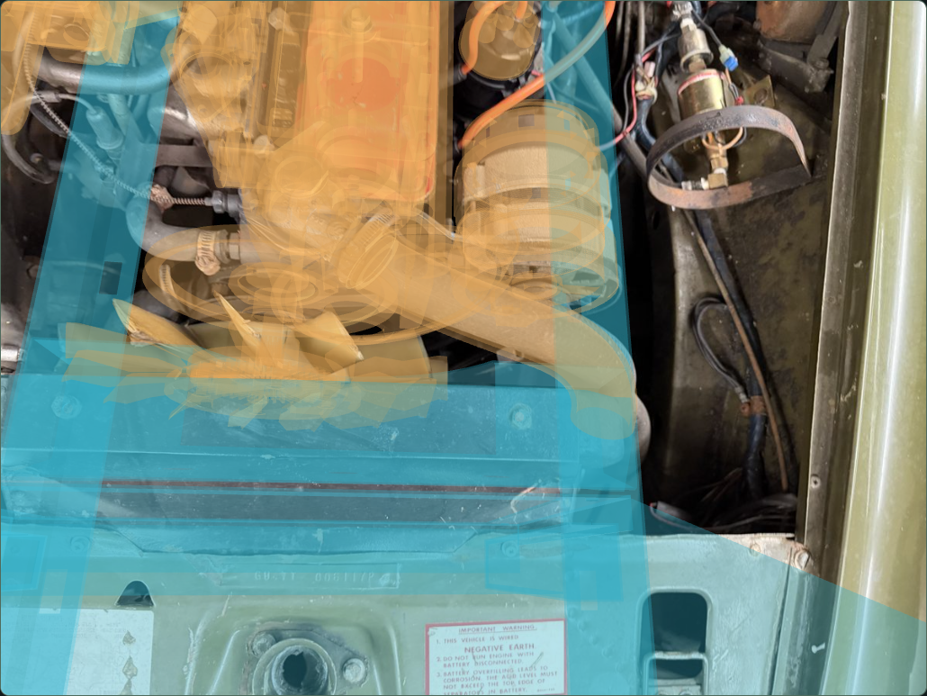 Current amber front-drive construction over the owner engine-bay photograph, with blue body surroundings