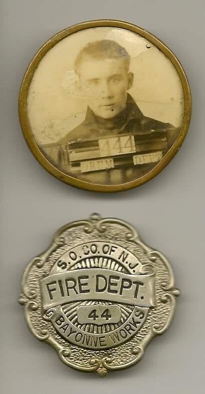 A Standard Oil of New Jersey works fire department badge, number 44, Bayonne Works, with the photographic identity badge that went with it